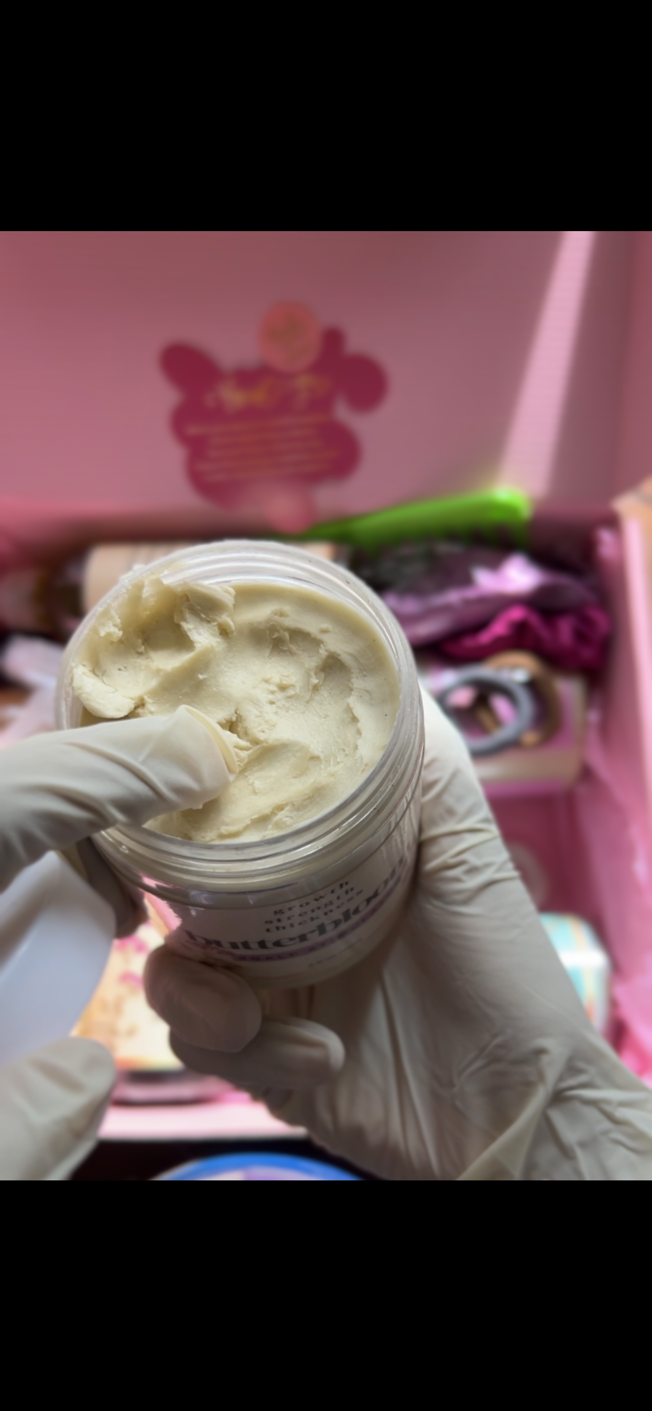 Butterbloom hair growth scalp stimulator balm in a jar with a smooth, creamy texture and natural ingredients visible.