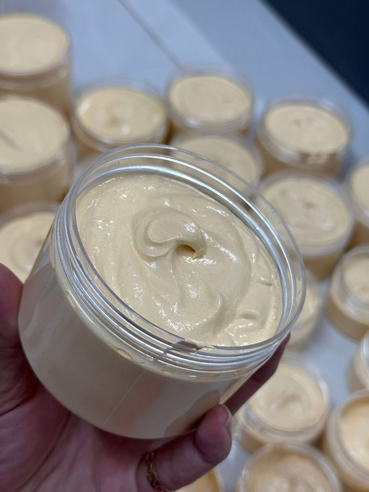 Butterbloom hair growth scalp stimulator balm applied to scalp, showing the nourishing formula for promoting healthy hair growth.