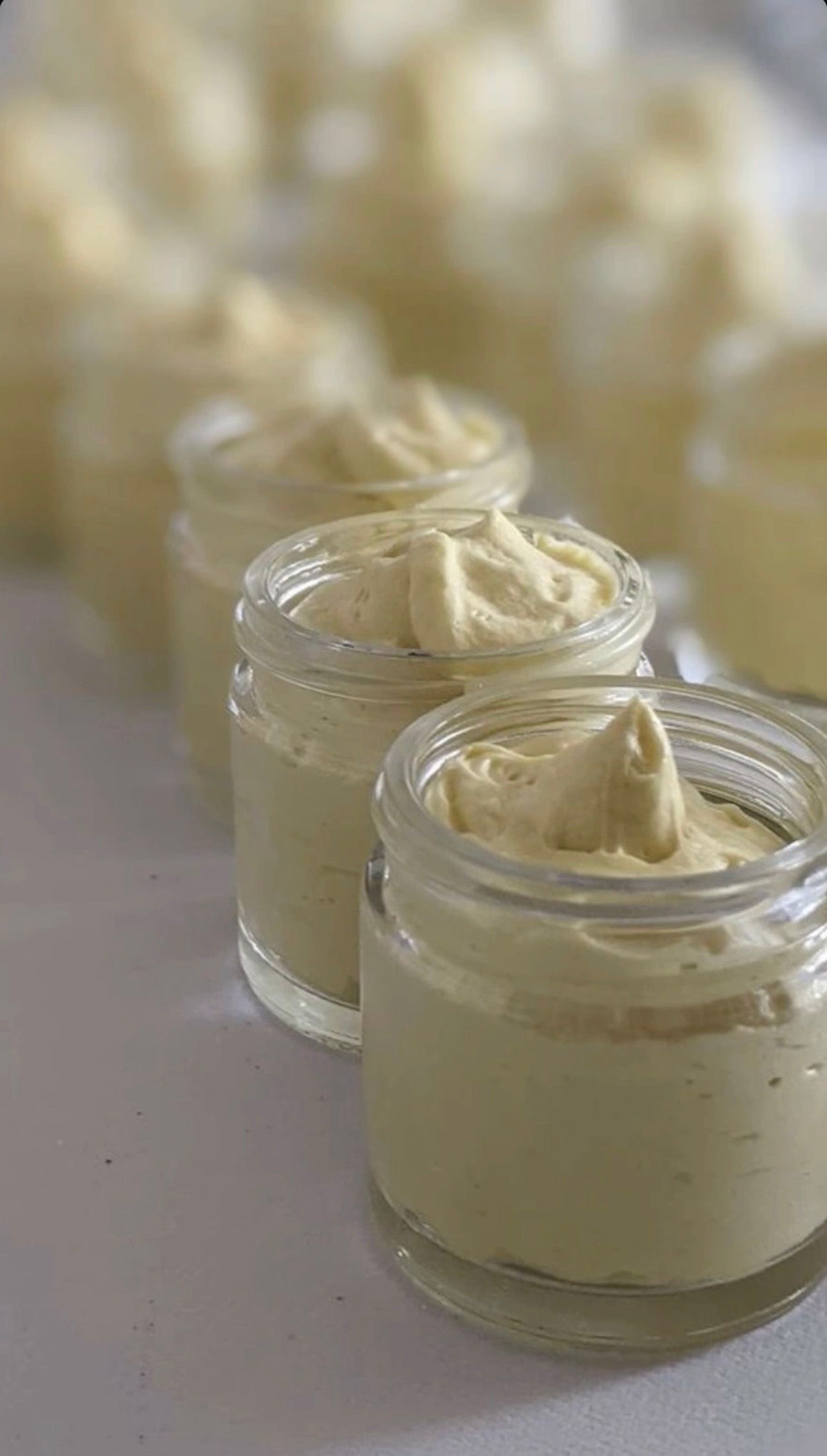 Butterbloom hair growth scalp stimulator balm applied to scalp, showing its smooth texture and natural ingredients for healthy hair growth.