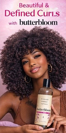 Butterbloom African black soap shampoo bottle designed for hair growth, with a rich, creamy texture visible.
