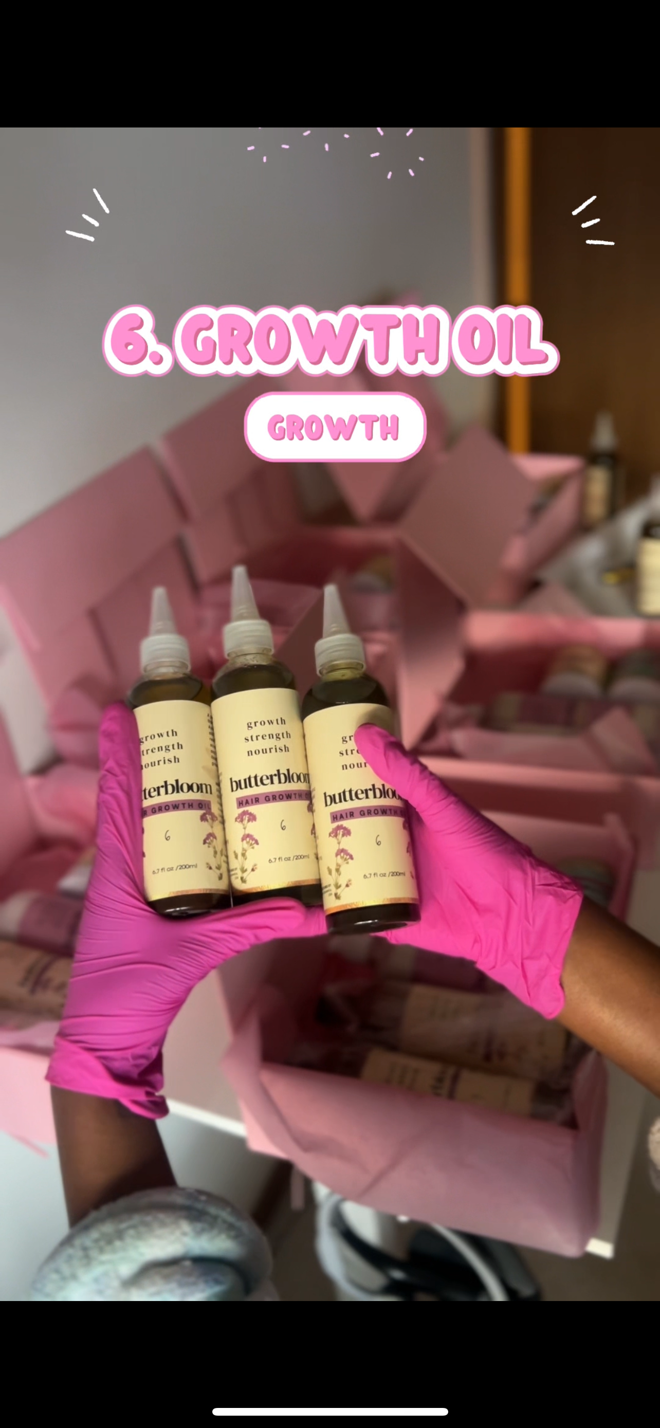 Butterbloom hair growth oil bottle featuring 21 herbs, with a dark glass design and herbal elements in the background.