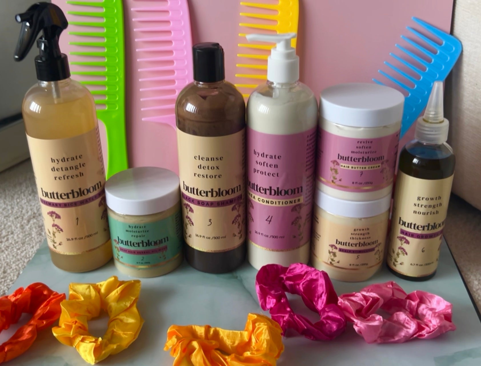 Hair growth bundle by butterbloom featuring shea butter, rice water, African black soap shampoo, and growth oil.